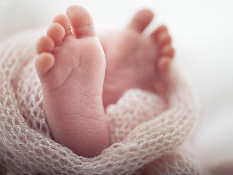 Close-up of a newborn baby heel prepared for screening